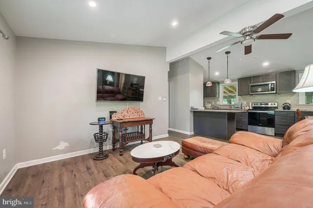 a view of a livingroom with furniture and a flat screen tv