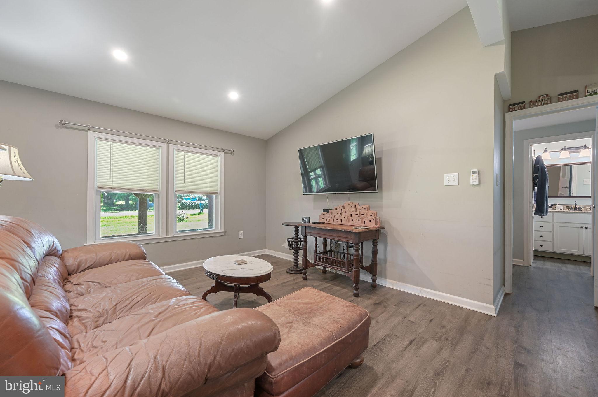 2821 Sandtown Road Felton, DE 19943 - Photo 10 of 26 a spacious bedroom with a bed and a flat screen tv