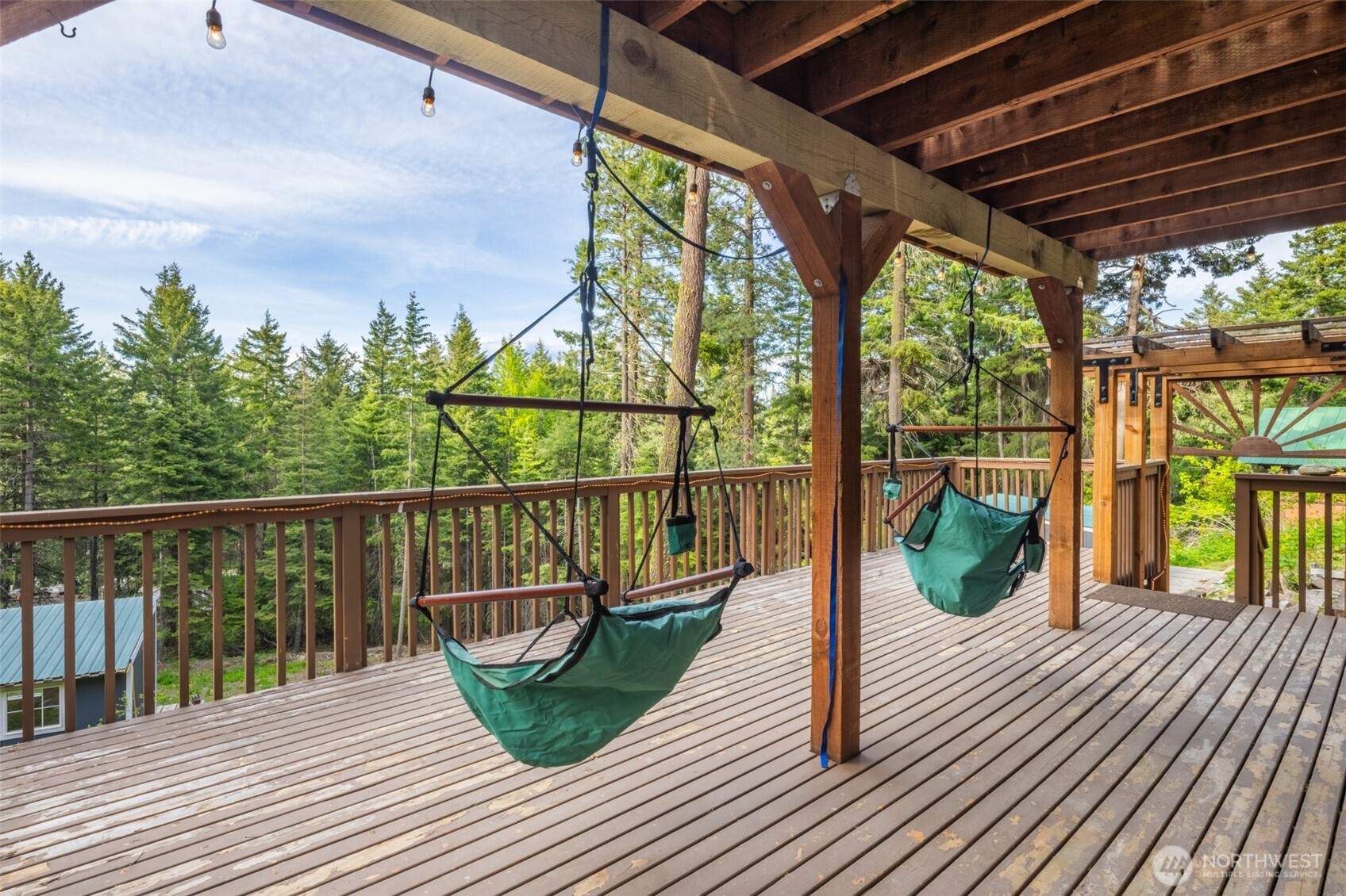 451 Aspen Springs Road Cle Elum, WA 98922 - Photo 13 of 27 a view of balcony with wooden floor and seating space