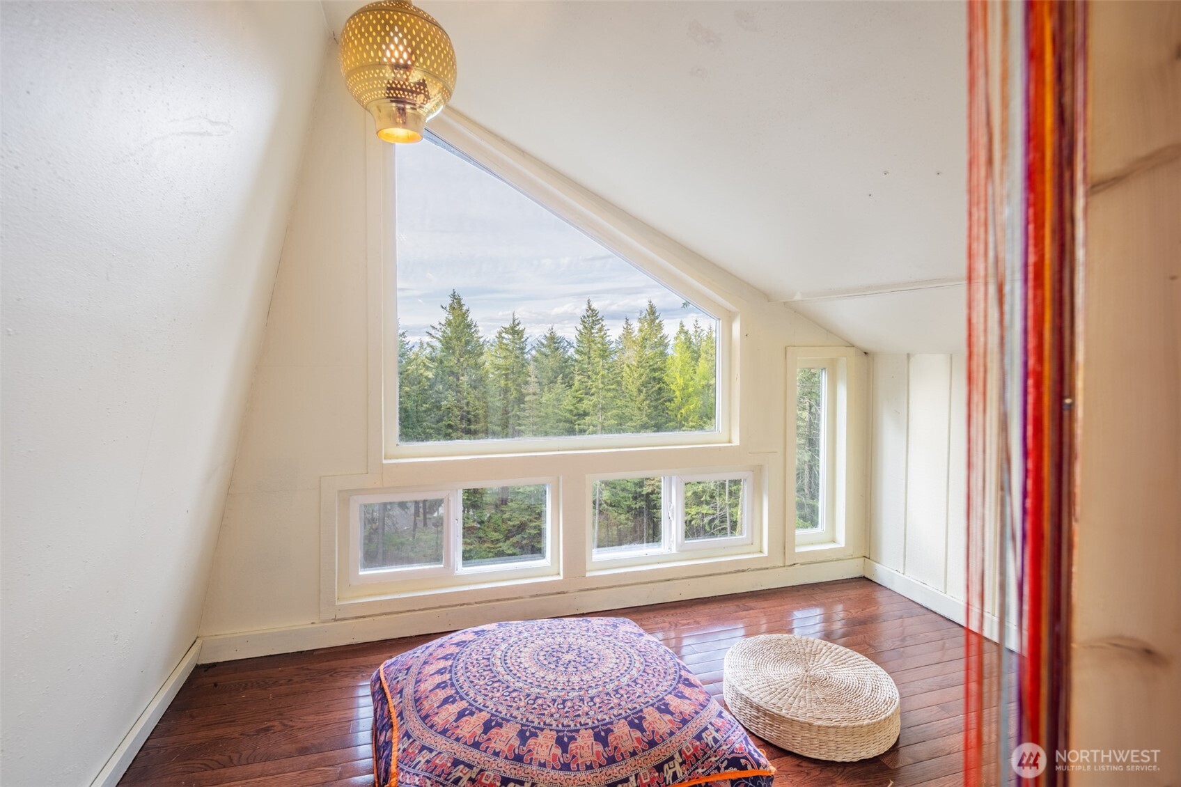 451 Aspen Springs Road Cle Elum, WA 98922 - Photo 9 of 27 a front view of a house with wooden floor and a window