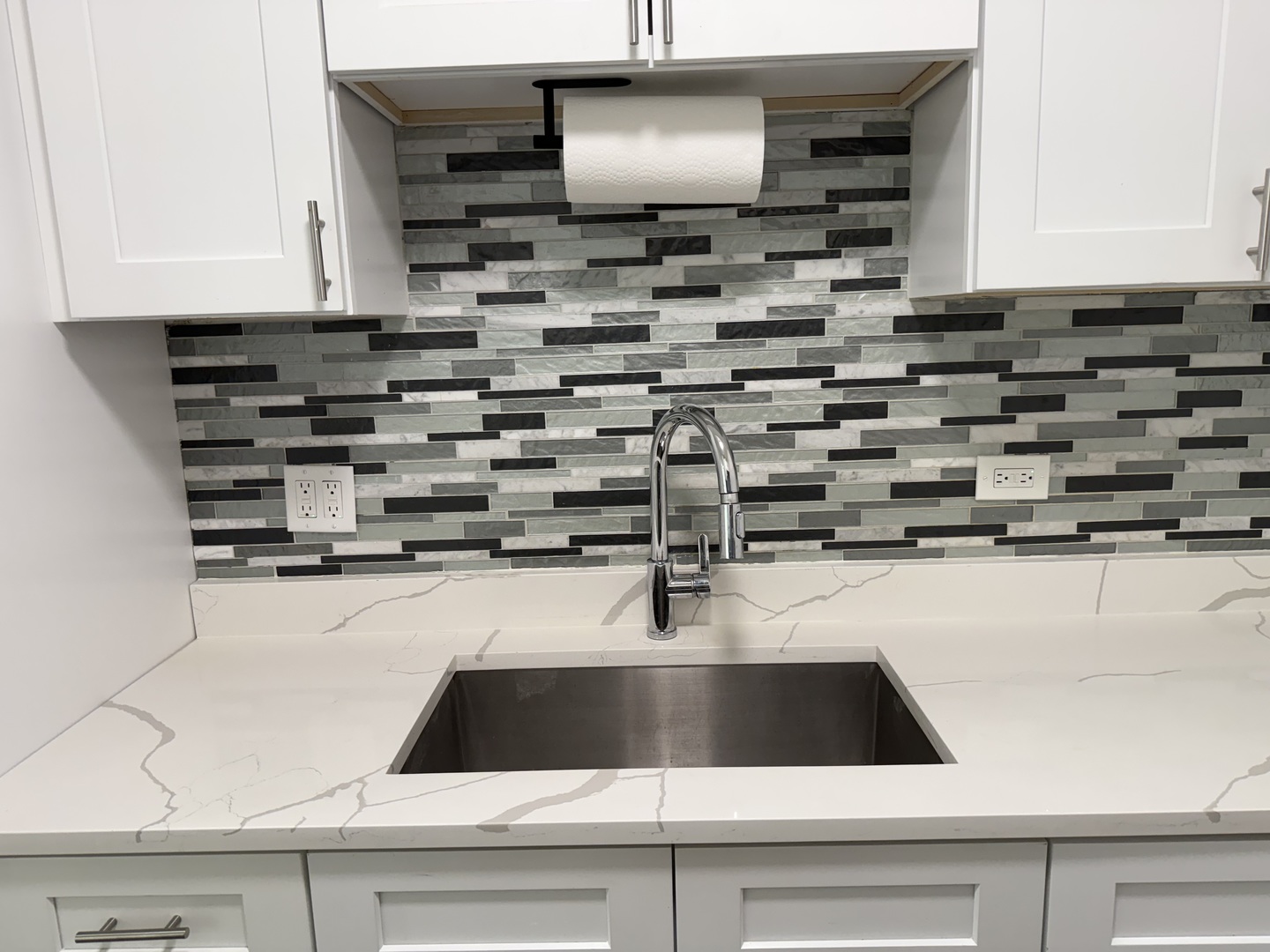 16W525 Mockingbird Lane, Unit 102 Willowbrook, IL 60527 - Photo 12 of 25 a kitchen with a sink and a stove
