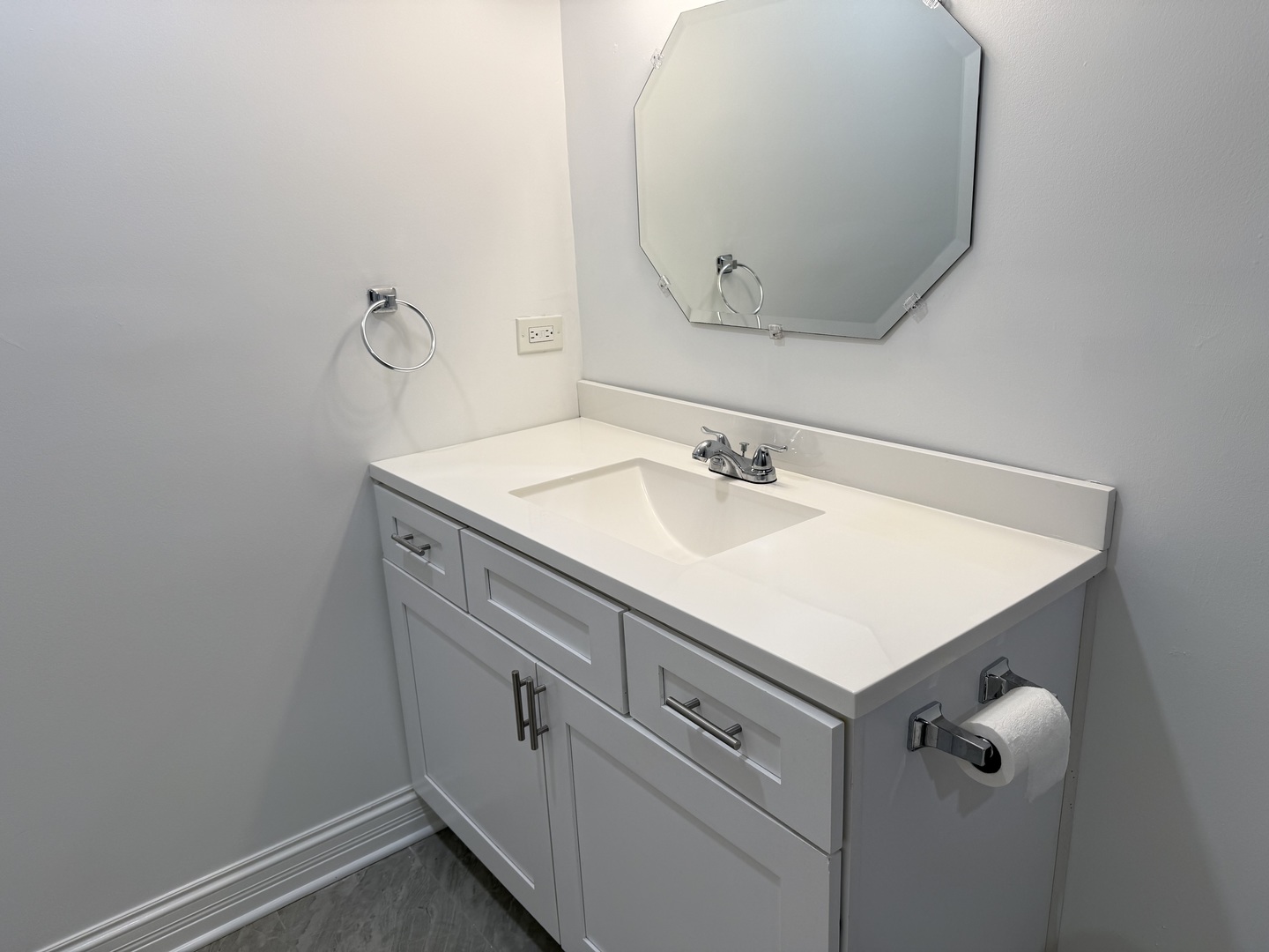 16W525 Mockingbird Lane, Unit 102 Willowbrook, IL 60527 - Photo 19 of 25 a bathroom with a sink and mirror