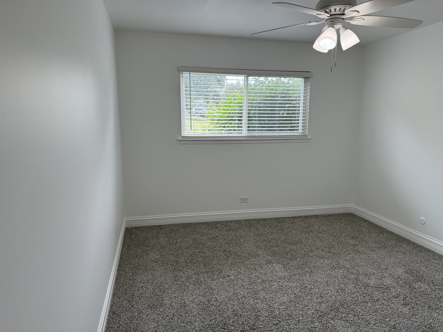 16W525 Mockingbird Lane, Unit 102 Willowbrook, IL 60527 - Photo 24 of 25 an empty room with a window