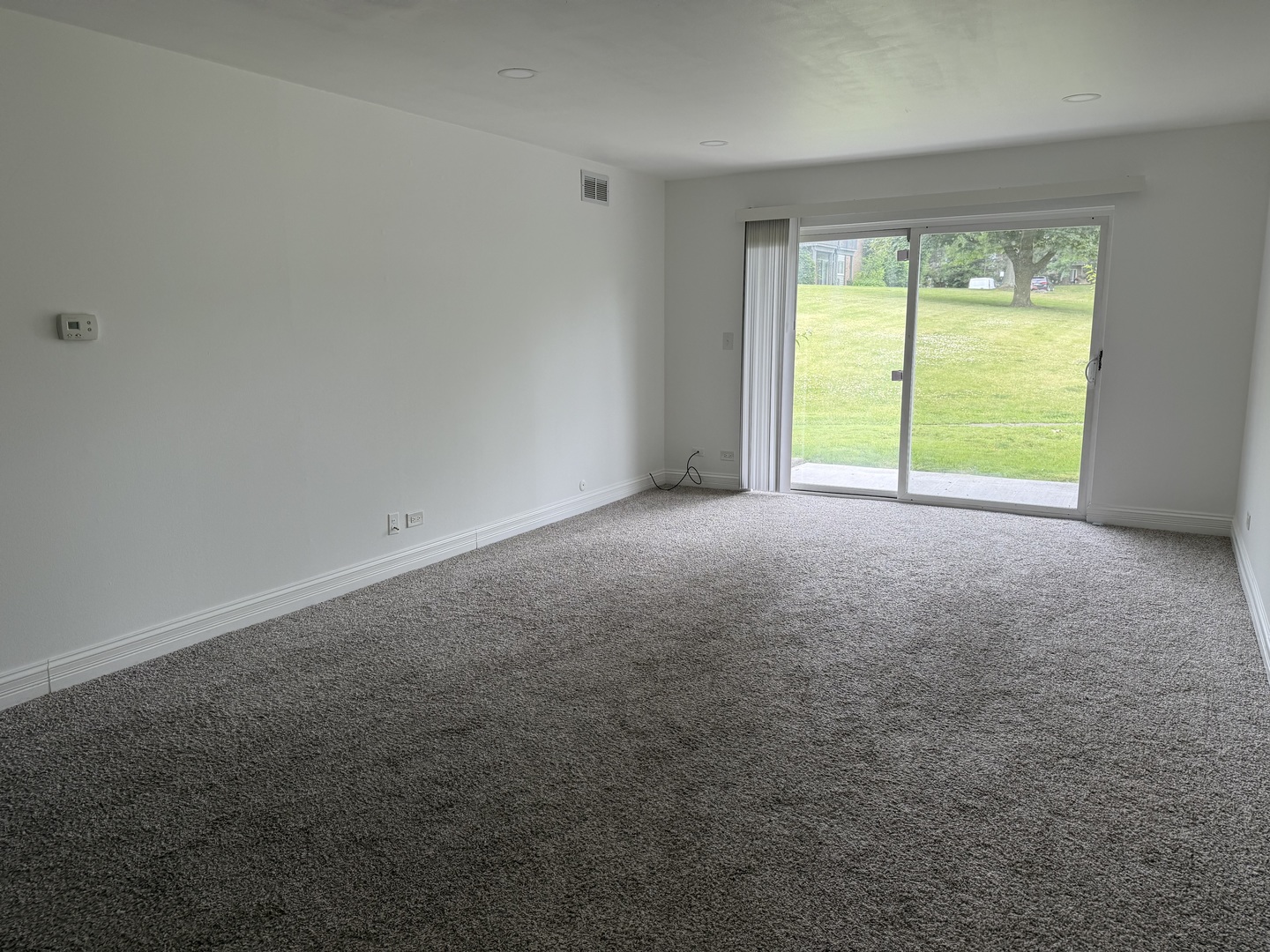 16W525 Mockingbird Lane, Unit 102 Willowbrook, IL 60527 - Photo 6 of 25 a view of an empty room with a window