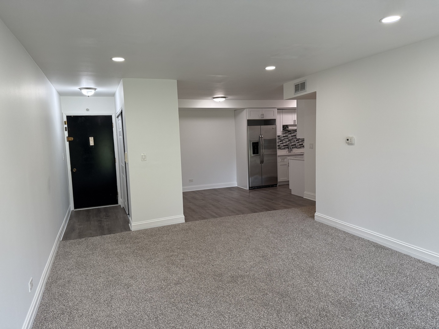 16W525 Mockingbird Lane, Unit 102 Willowbrook, IL 60527 - Photo 8 of 25 an empty room with a closet and a window