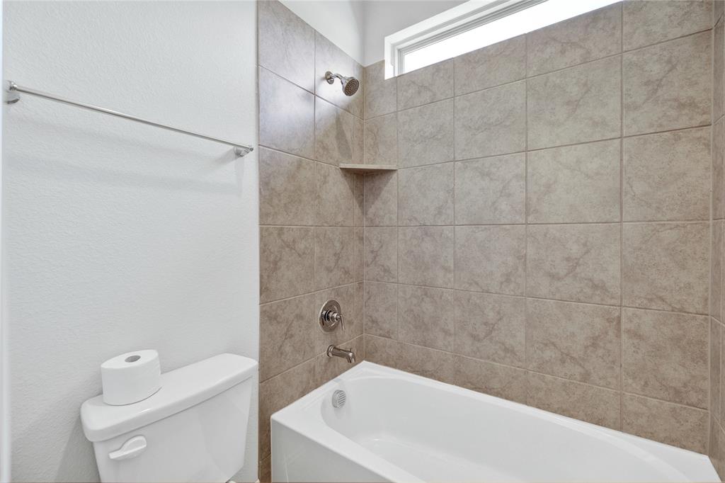 2307 Sam Street Mansfield, TX 76063 - Photo 5 of 23 Full bathroom featuring shower / washtub combination and a textured wall