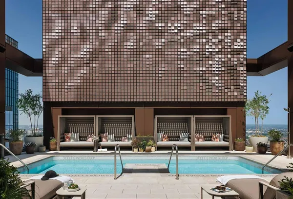 a view of a patio with dining table and chairs with potted plants