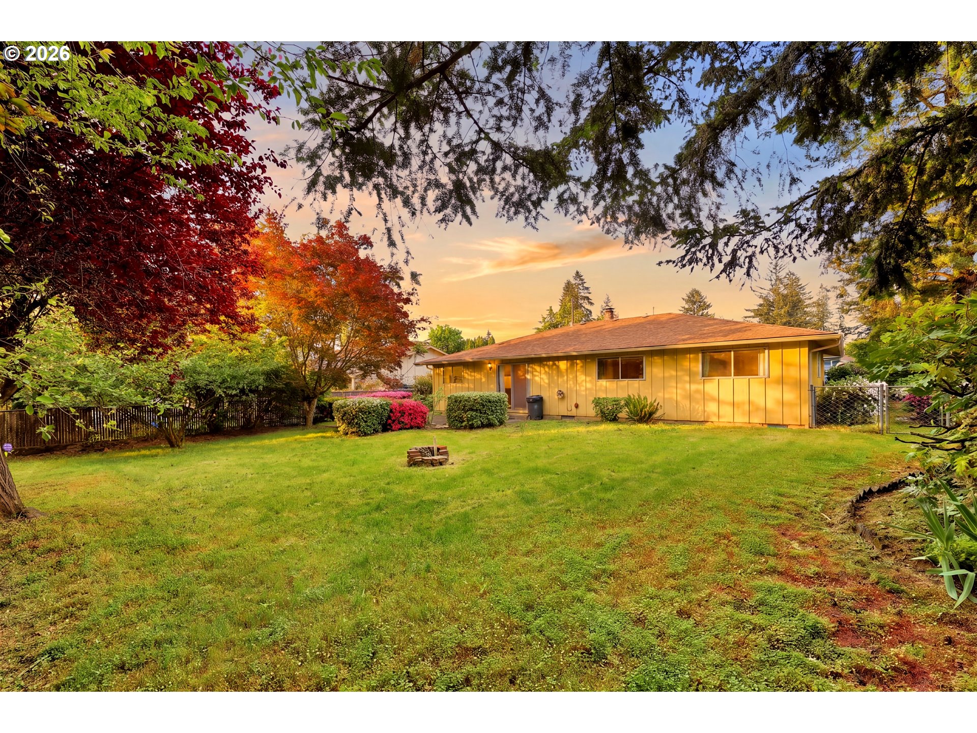 3003 Southeast 162nd Avenue Portland, OR 97236 - Photo 4 of 41 a front view of a house with a yard