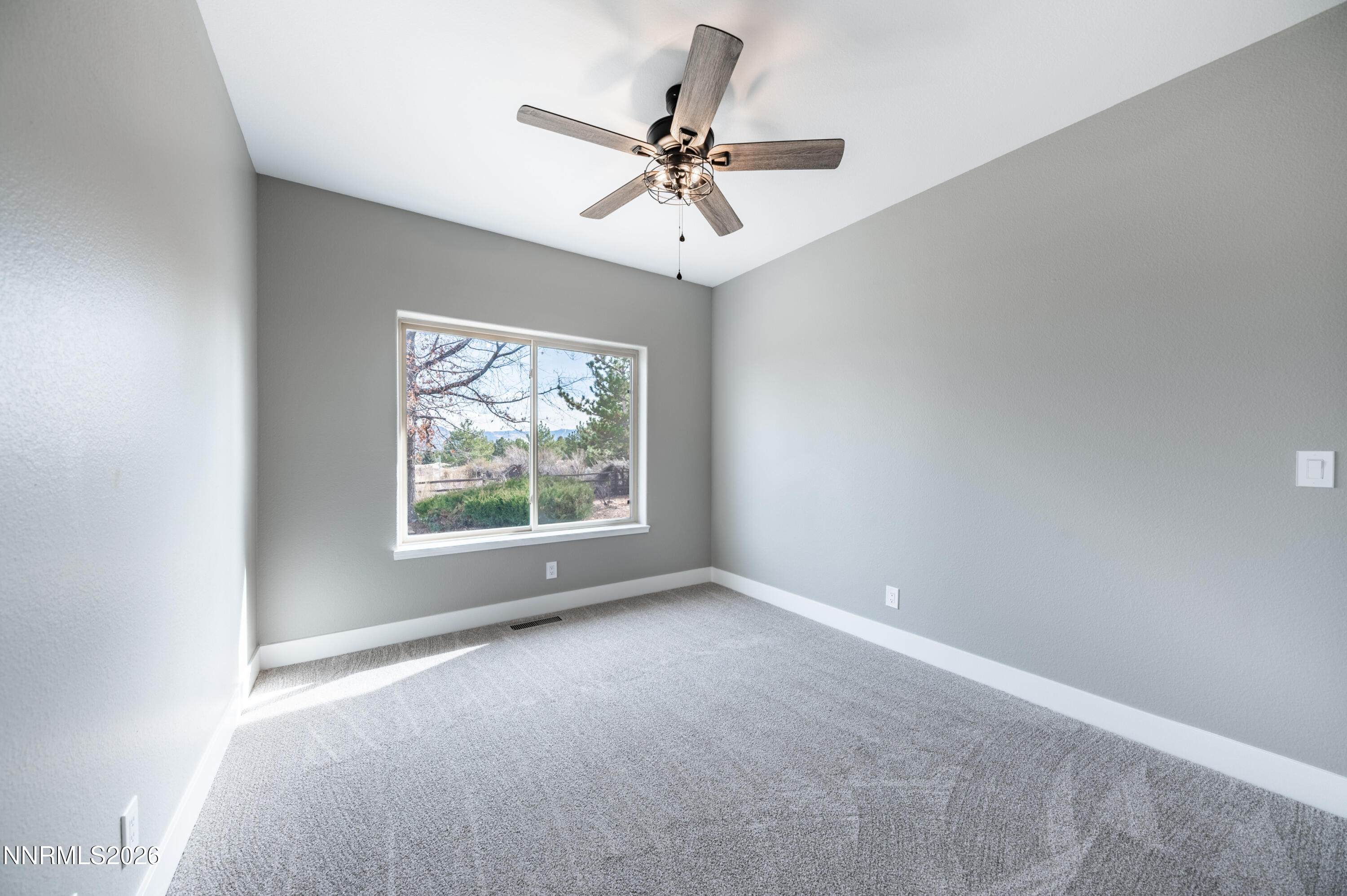 14330 East Windriver Lane Reno, NV 89511 - Photo 29 of 36 an empty room with a window and a fan