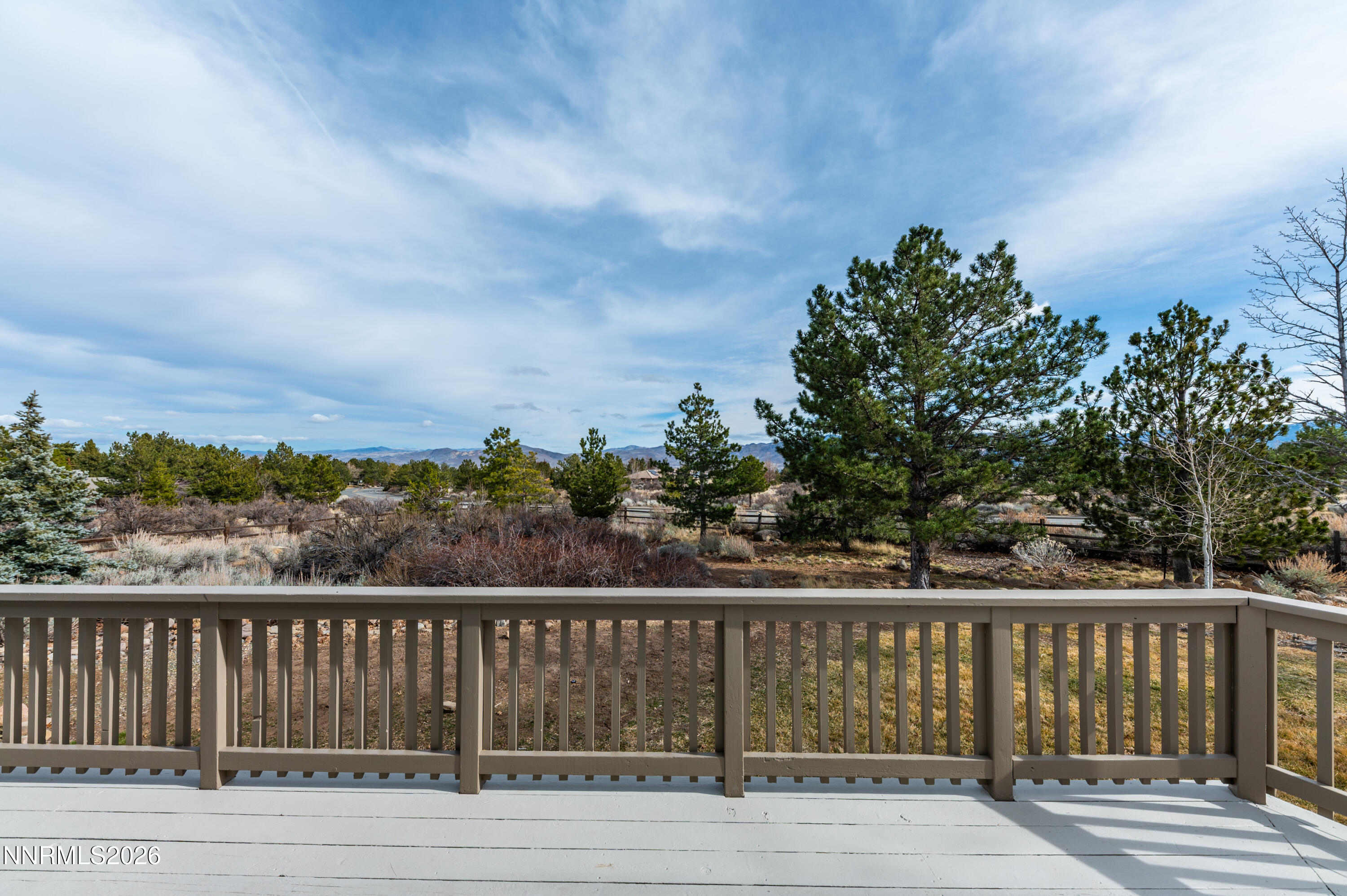 14330 East Windriver Lane Reno, NV 89511 - Photo 31 of 36 a view of balcony with wooden floor and fence