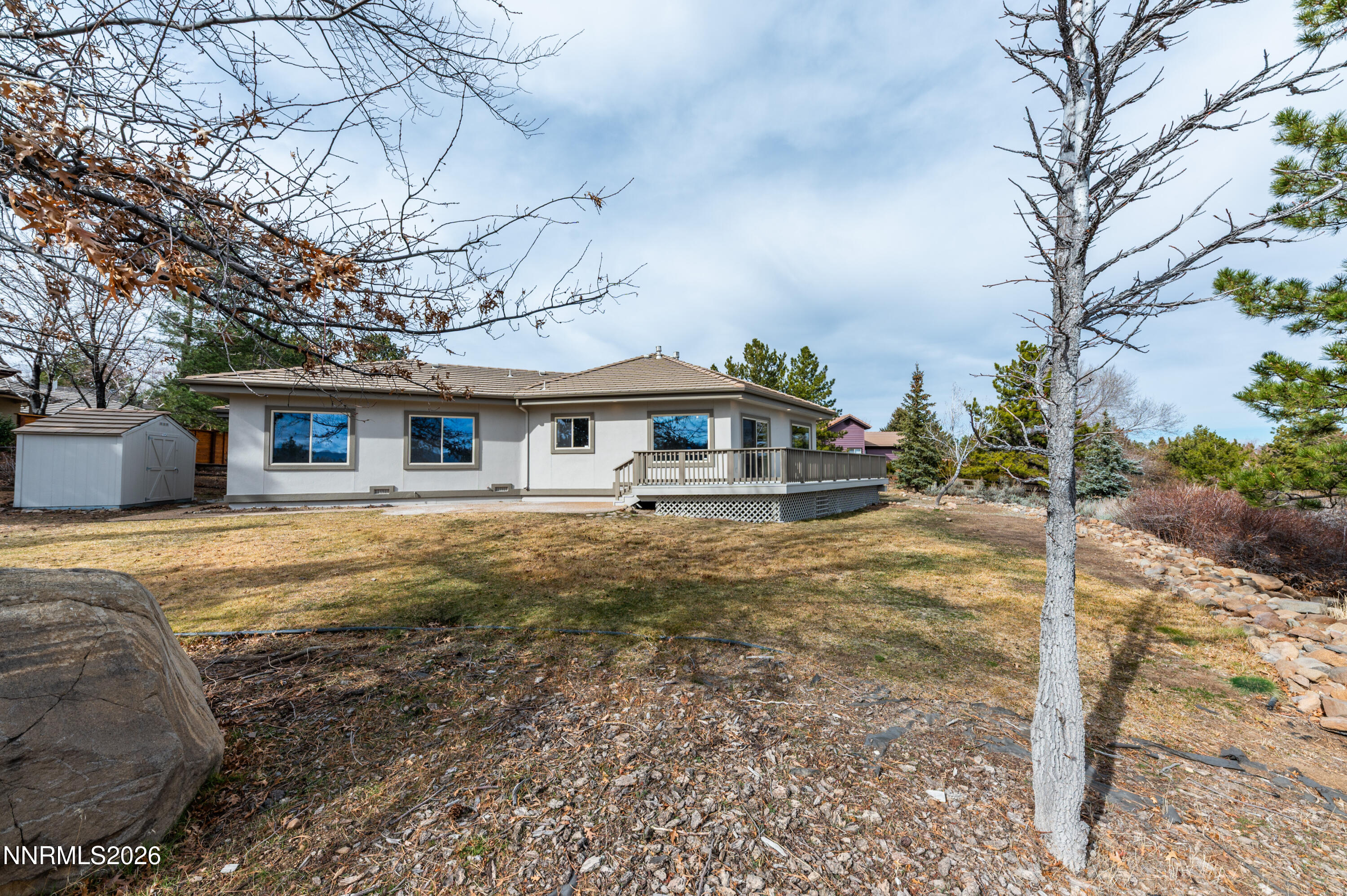 14330 East Windriver Lane Reno, NV 89511 - Photo 33 of 36 a front view of a house with a yard