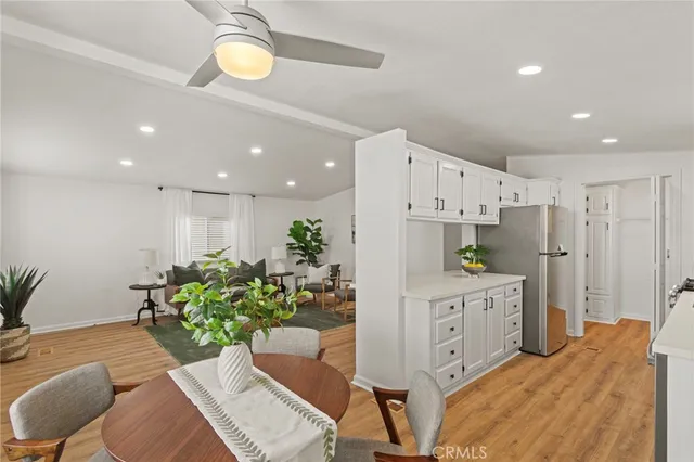 a kitchen with a sink and refrigerator
