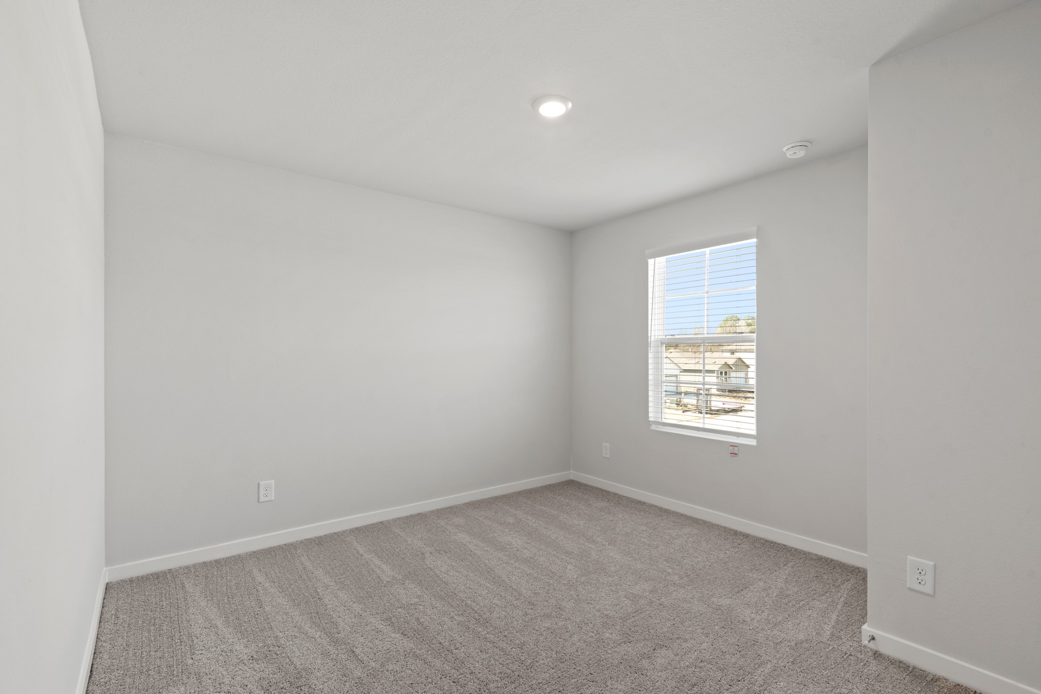 322 Amy Street Angleton, TX 77515 - Photo 14 of 27 an empty room with a window