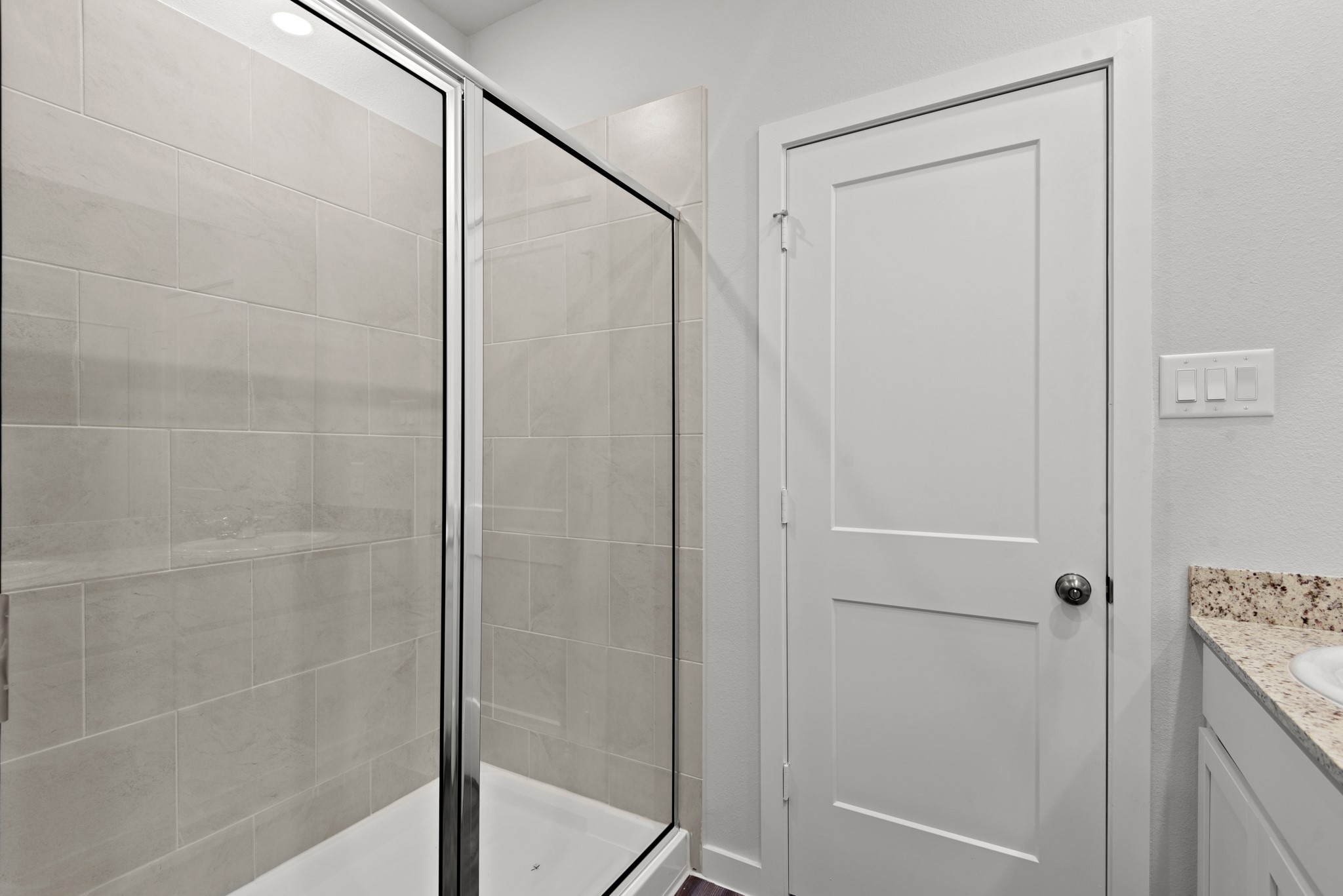 322 Amy Street Angleton, TX 77515 - Photo 10 of 27 a bathroom with a glass shower door