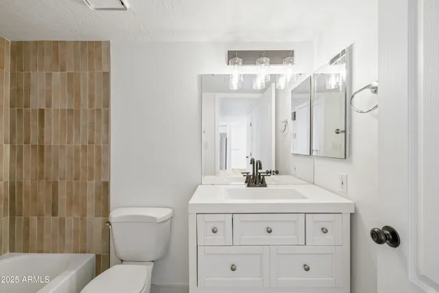 a bathroom with a bathtub and shower