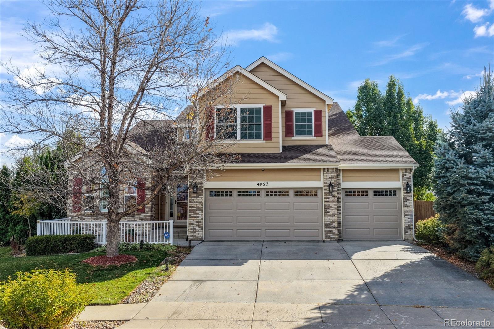 4457 Centerville Drive Colorado Springs, CO 80922 - Photo 1 of 50 a front view of a house with a yard and garage