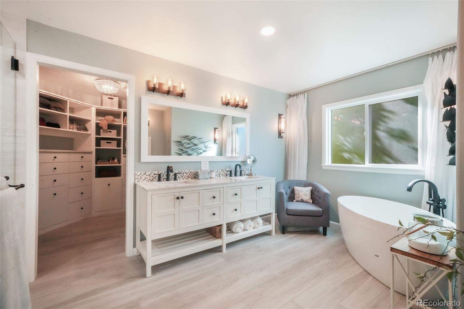 4457 Centerville Drive Colorado Springs, CO 80922 - Photo 29 of 50 a room with a baby bed couch and dresser