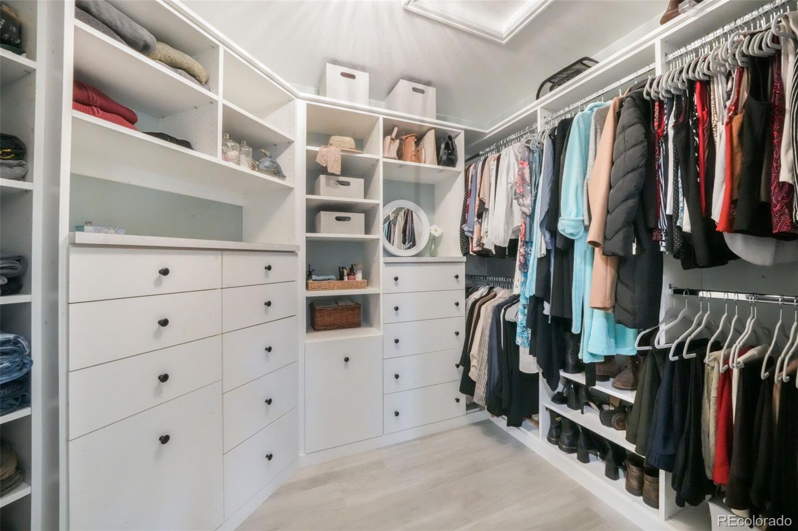4457 Centerville Drive Colorado Springs, CO 80922 - Photo 32 of 50 a view of walk in closet with clothes and shoes