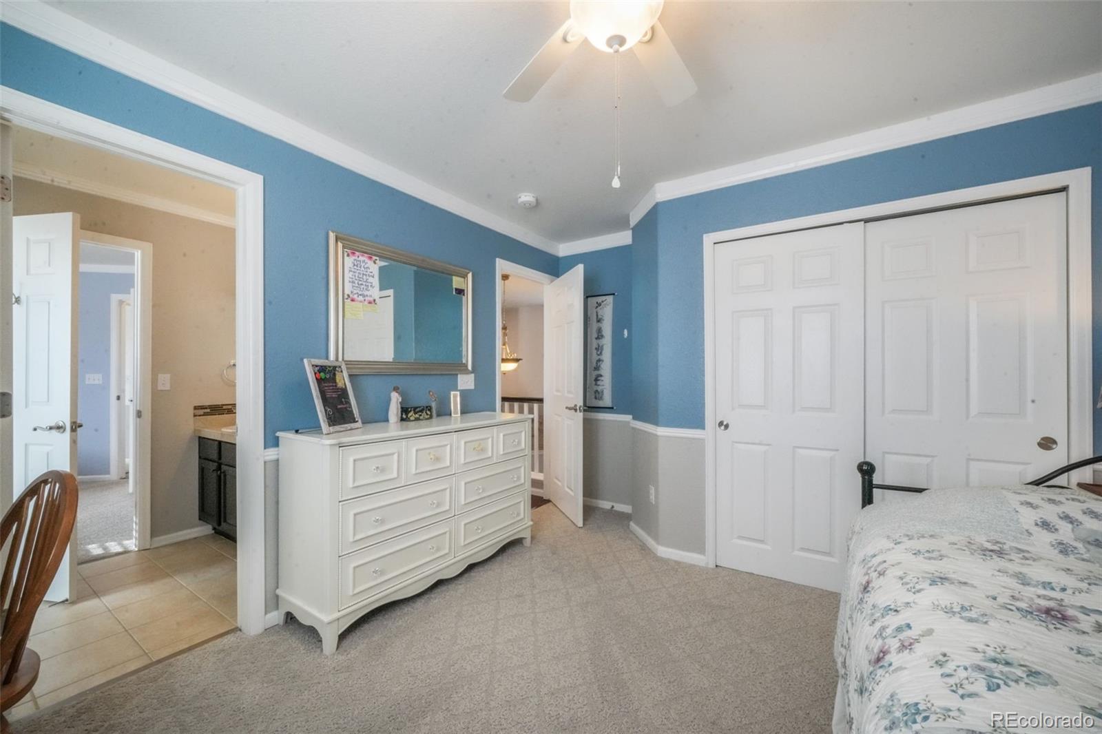 4457 Centerville Drive Colorado Springs, CO 80922 - Photo 41 of 50 a room with a bed and a view of bathroom