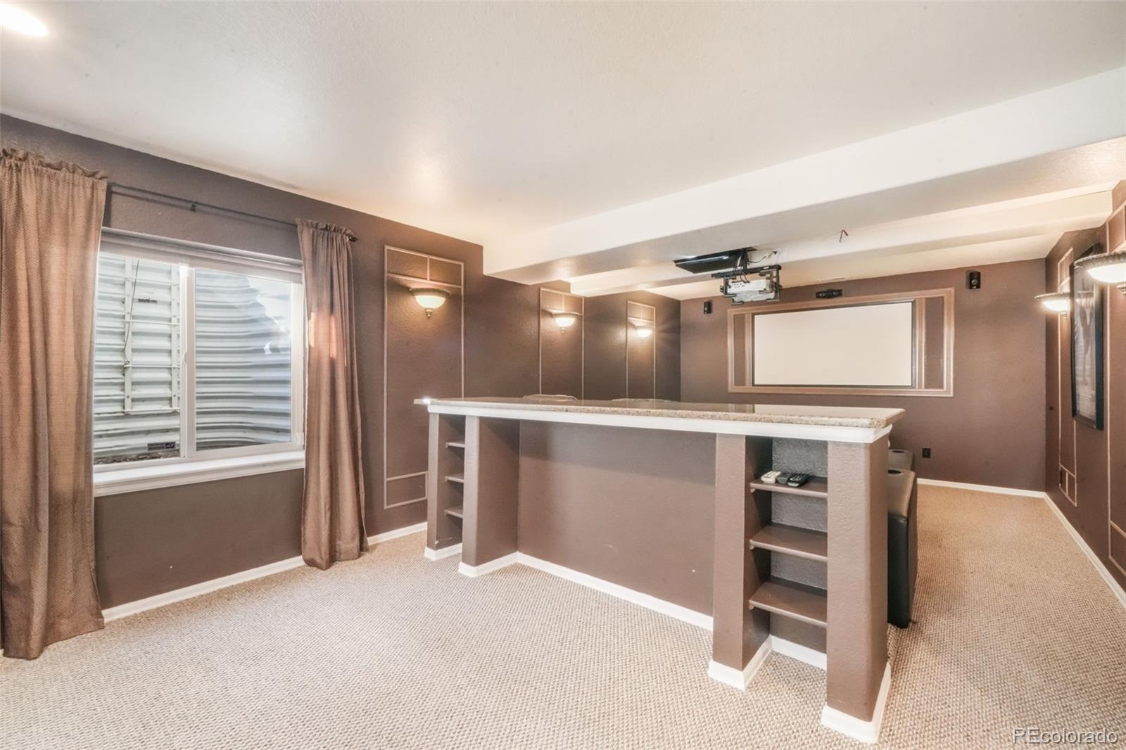 4457 Centerville Drive Colorado Springs, CO 80922 - Photo 46 of 50 a view of an empty room with a fireplace