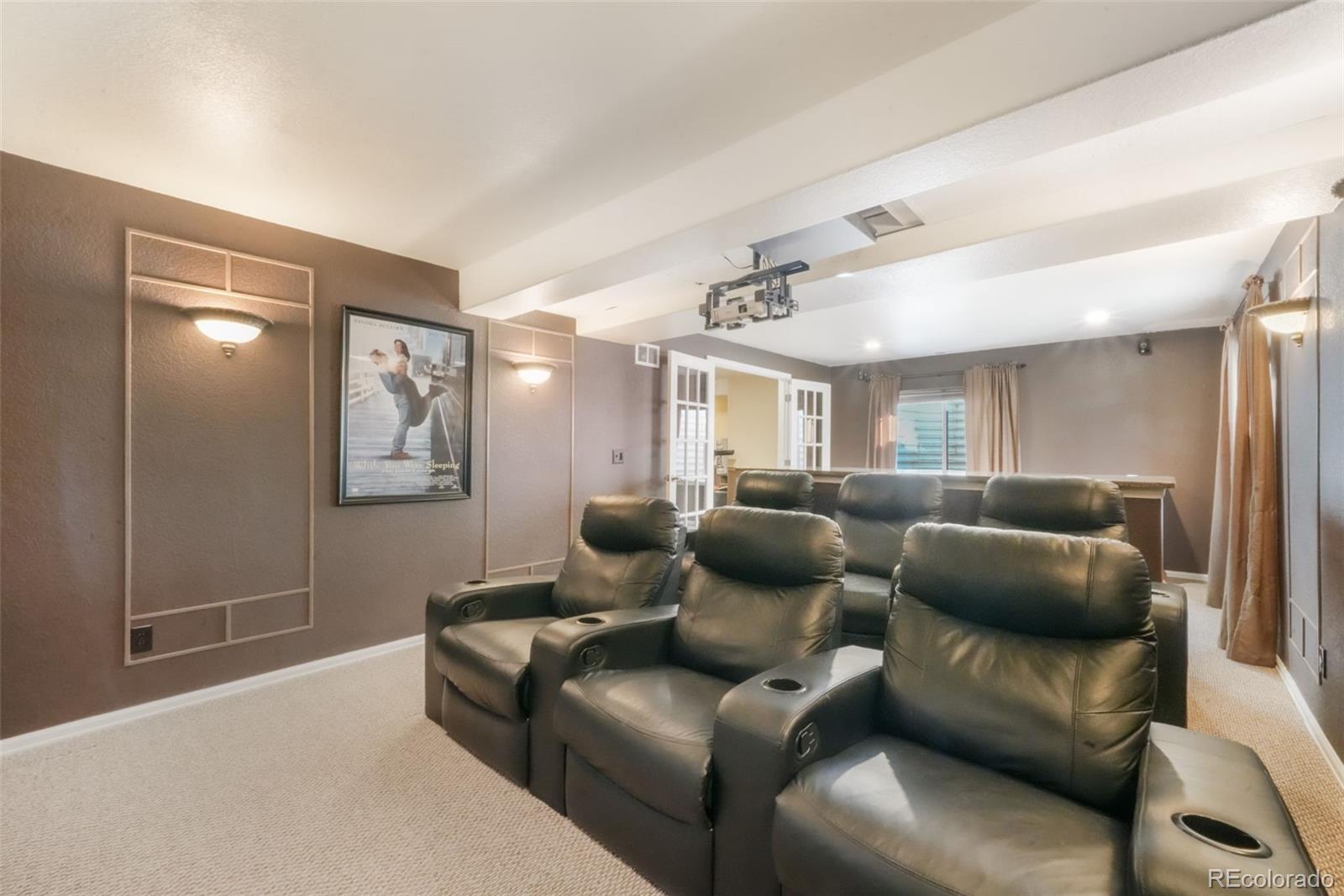4457 Centerville Drive Colorado Springs, CO 80922 - Photo 47 of 50 a living room with furniture and a glass door