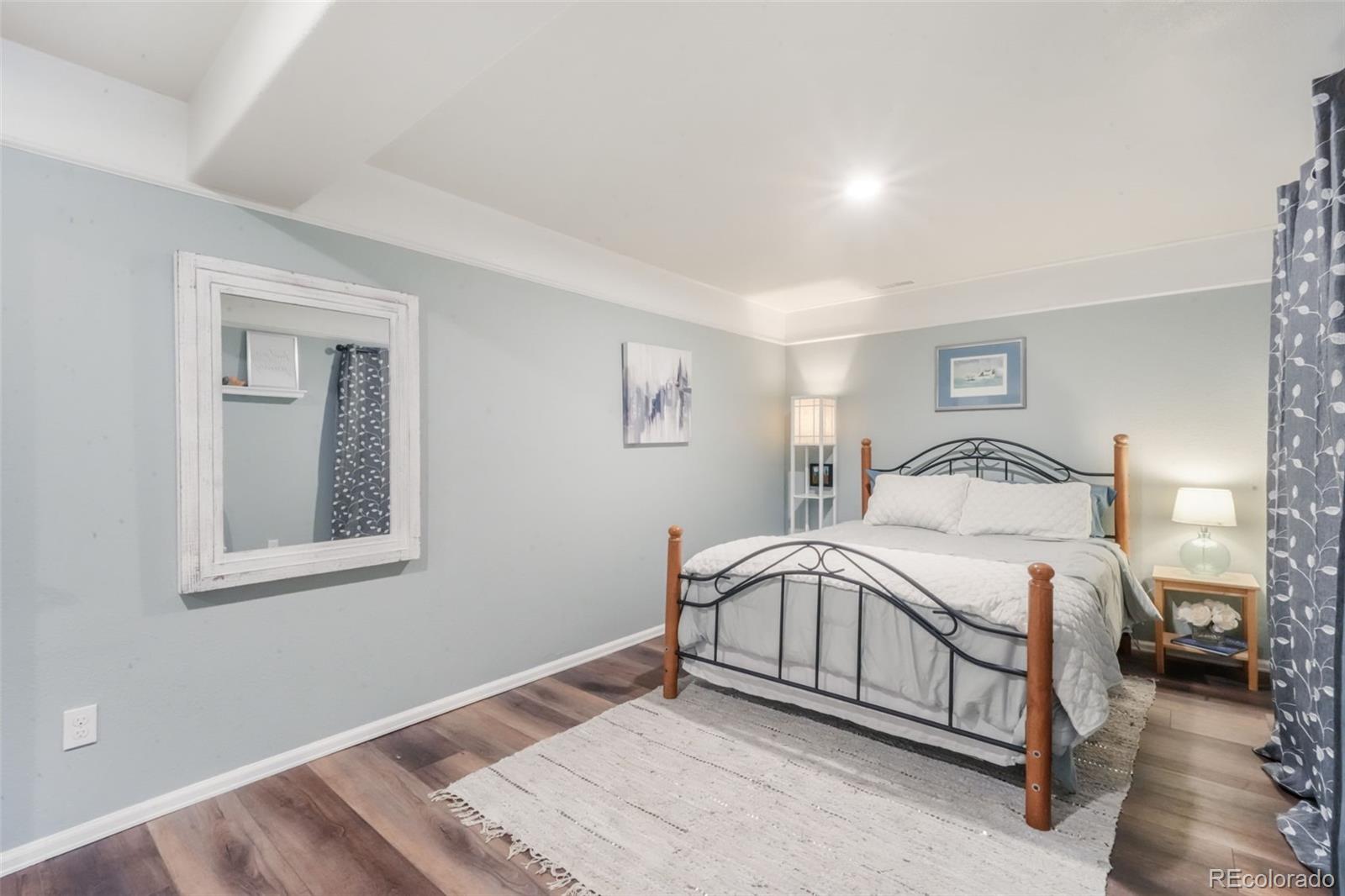 4457 Centerville Drive Colorado Springs, CO 80922 - Photo 48 of 50 a bedroom with a bed and a window