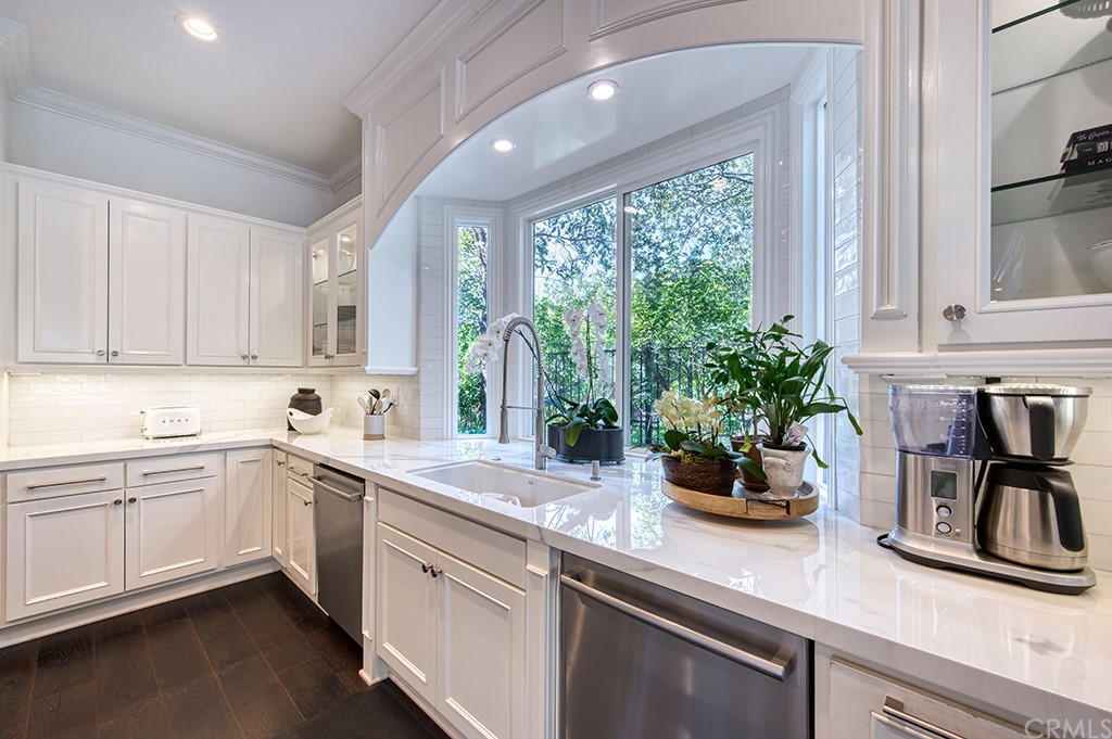 4 Black Walnut Coto de Caza, CA 92679 - Photo 12 of 39 a kitchen with a sink a window and potted plant