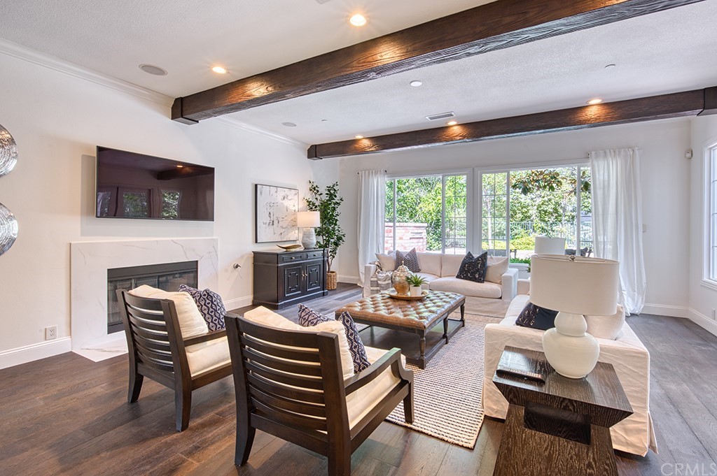 4 Black Walnut Coto de Caza, CA 92679 - Photo 17 of 39 a living room with fireplace furniture and a flat screen tv
