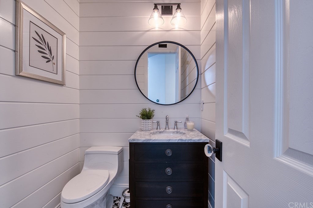 4 Black Walnut Coto de Caza, CA 92679 - Photo 18 of 39 a bathroom with a toilet sink vanity and mirror