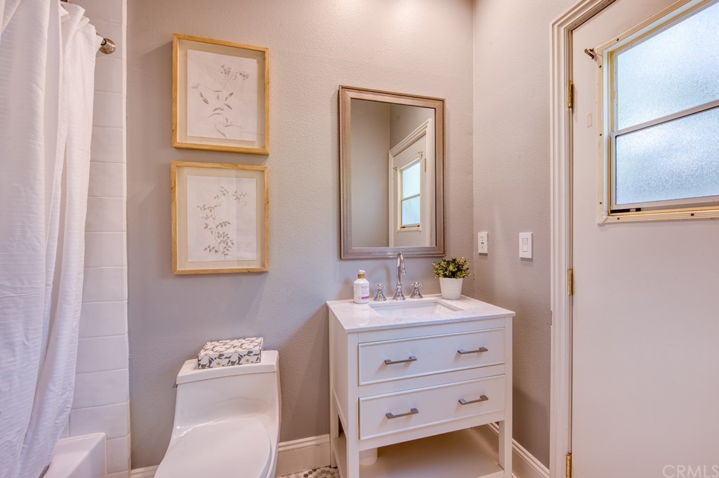 4 Black Walnut Coto de Caza, CA 92679 - Photo 20 of 39 a bathroom with a sink mirror and toilet