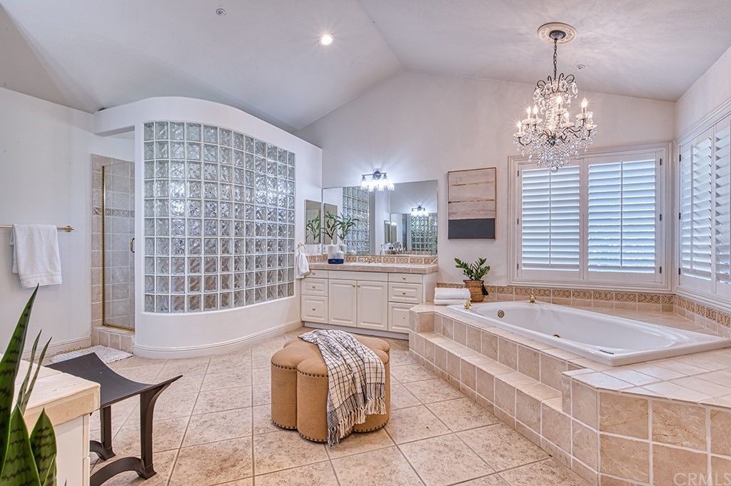 4 Black Walnut Coto de Caza, CA 92679 - Photo 26 of 39 a spacious bathroom with a tub sink and mirror