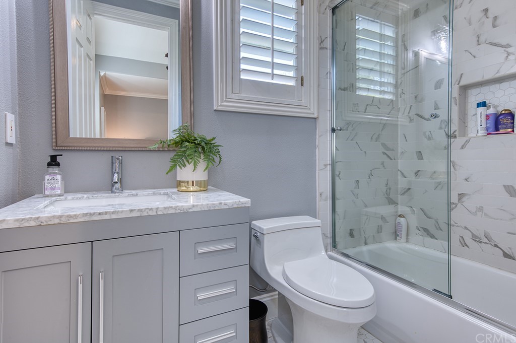 4 Black Walnut Coto de Caza, CA 92679 - Photo 29 of 39 a bathroom with a granite countertop sink toilet and shower