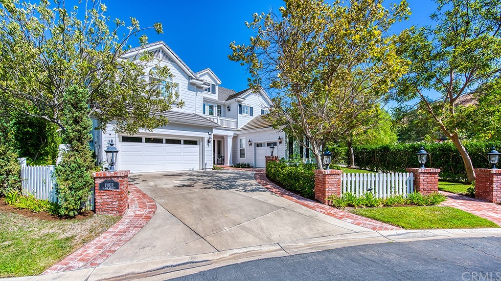 4 Black Walnut Coto de Caza, CA 92679 - Photo 3 of 39 a front view of a house with a garden and trees