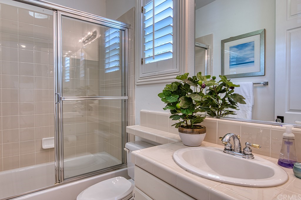 4 Black Walnut Coto de Caza, CA 92679 - Photo 31 of 39 a bathroom with a sink and a mirror
