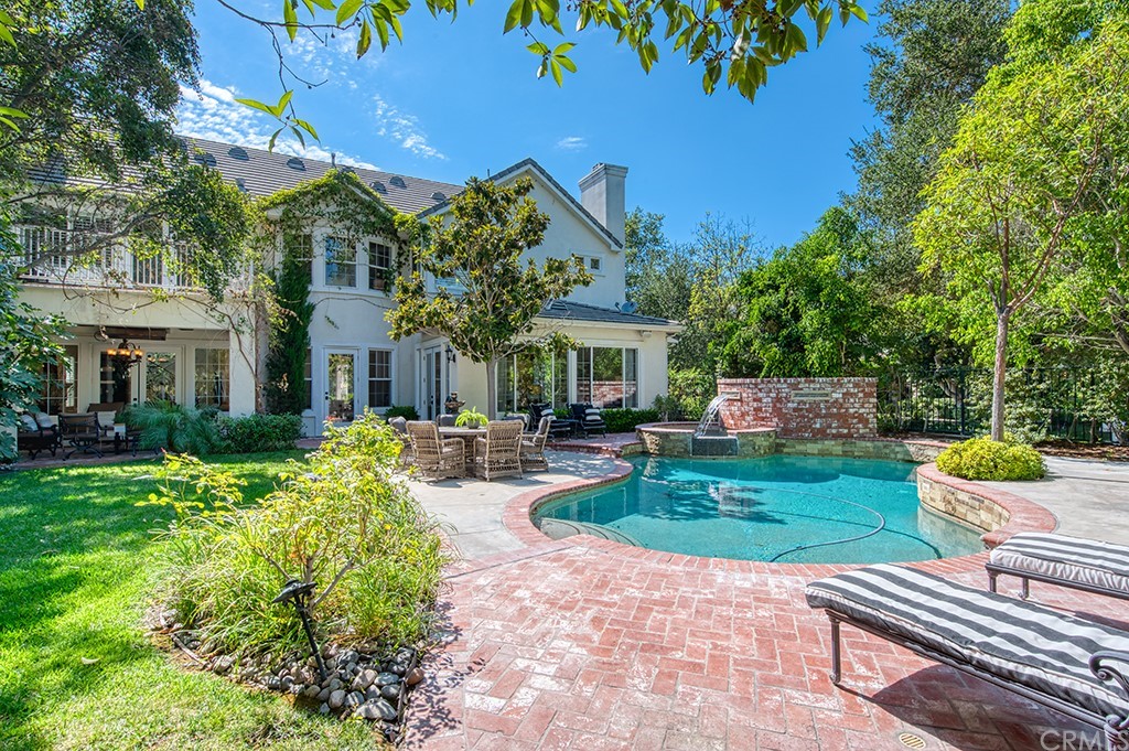 4 Black Walnut Coto de Caza, CA 92679 - Photo 4 of 39 a front view of a house with garden and chairs