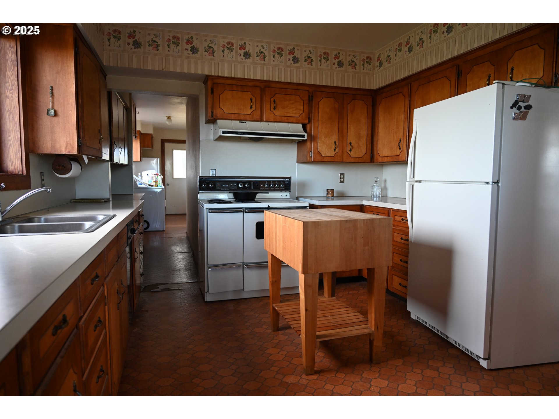75938 Spring Hollow Road Adams, OR 97810 - Photo 9 of 26 a kitchen with stainless steel appliances granite countertop a refrigerator a stove a sink and a microwave