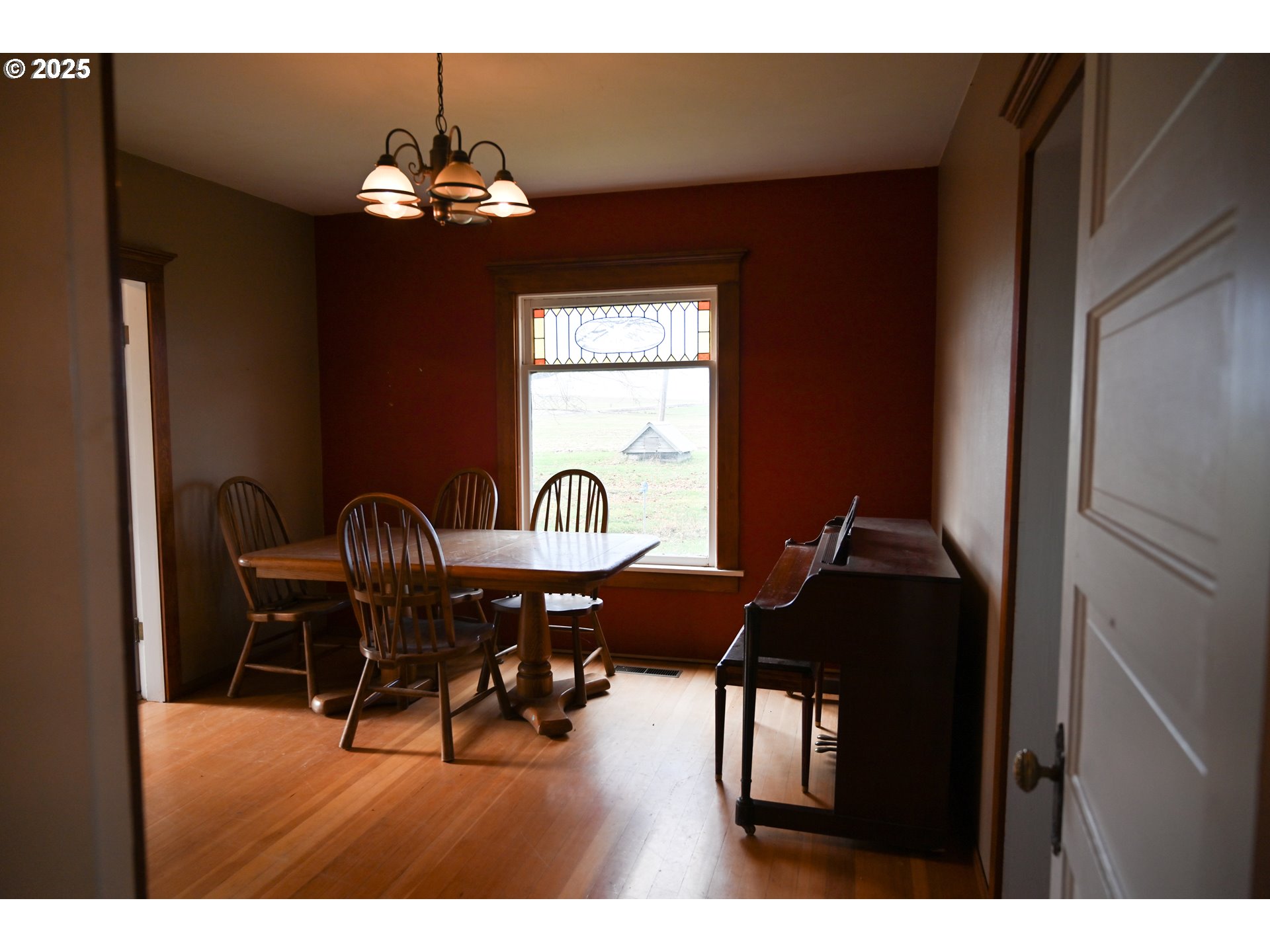 75938 Spring Hollow Road Adams, OR 97810 - Photo 10 of 26 a living room with furniture and a chandelier