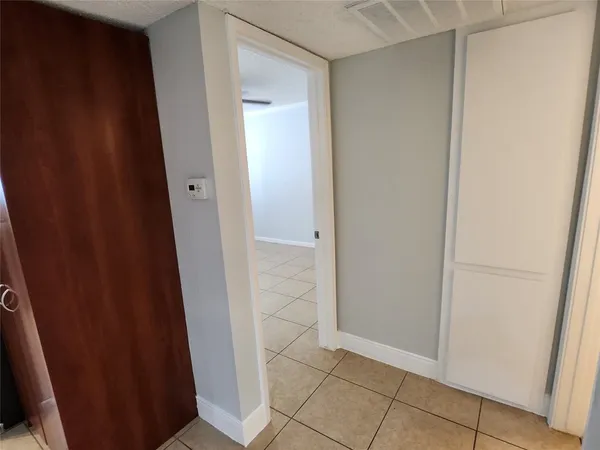 an empty room with wooden door