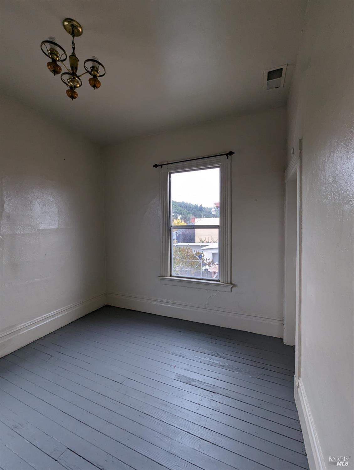 1547 4th Street, Unit A San Rafael, CA 94901 - Photo 55 of 64 wooden floor in an empty room with a window