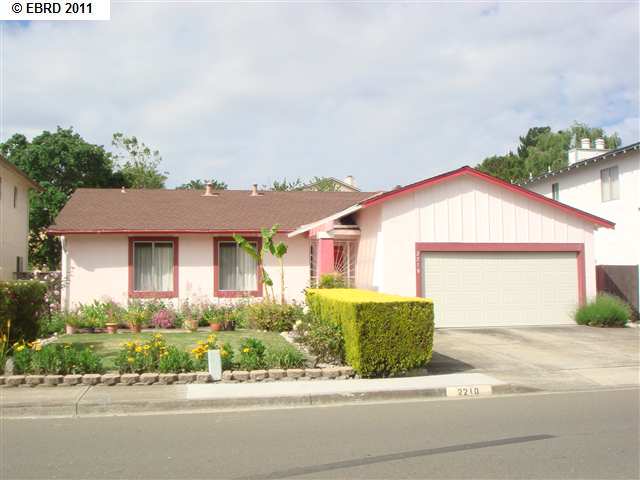 2210 Lupine Road Hercules, CA 94547 - Photo 1 of 1 a front view of a house with a yard and potted plants