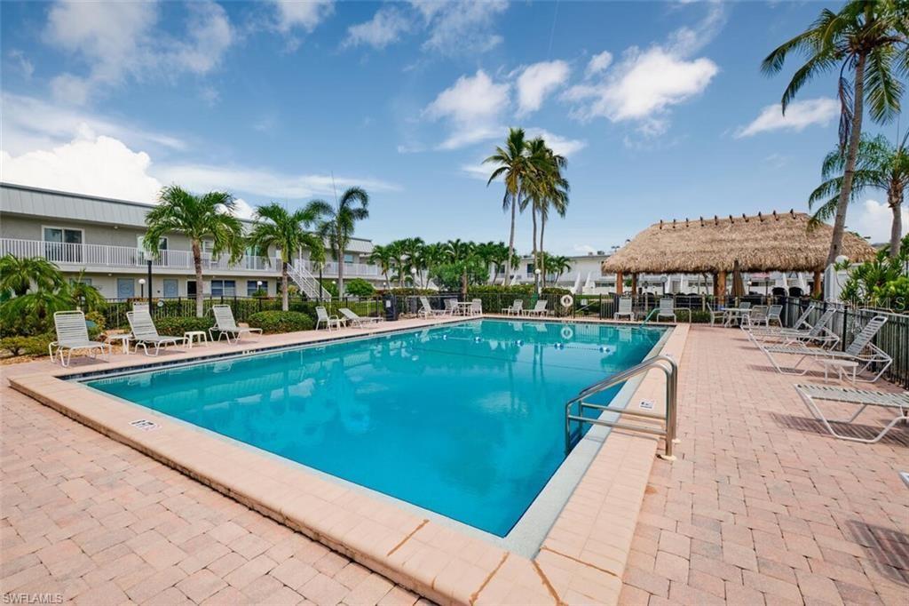 6777 Winkler Road, Unit 150 Fort Myers, FL 33919 - Photo 35 of 48 a view of swimming pool with outdoor seating and yard