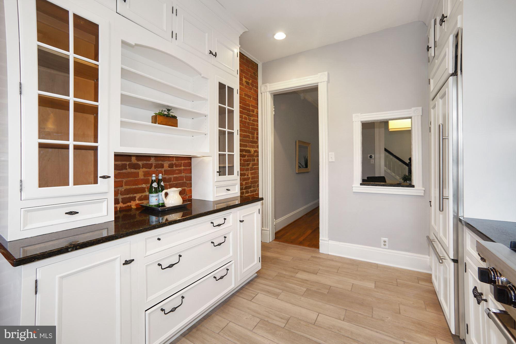 151 E Street Southeast Washington, DC 20003 - Photo 9 of 27 Kitchen with Exposed Brick