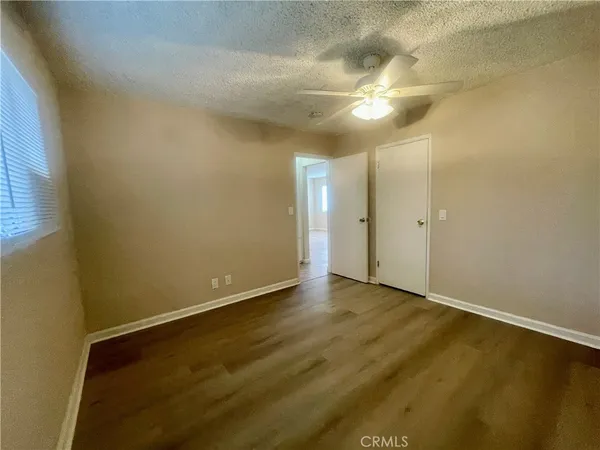 an empty room with a empty space and a window