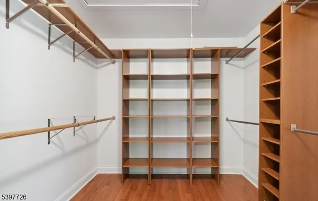 a bathroom with a granite countertop sink a toilet and a bathtub