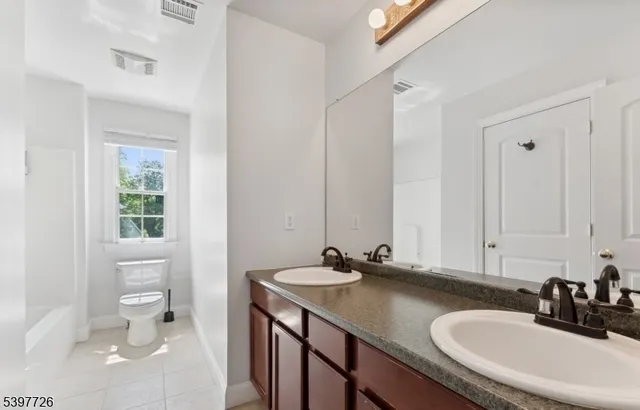 a work room with furniture and a table