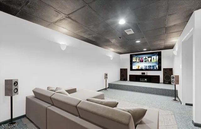 a bathroom with a granite countertop shower and a mirror