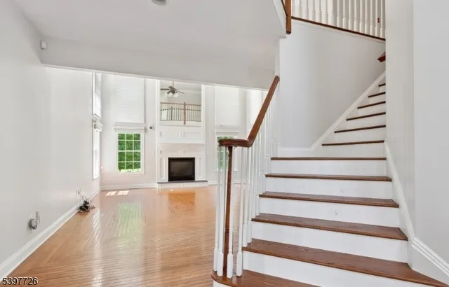 a living room with furniture fireplace and flat screen tv