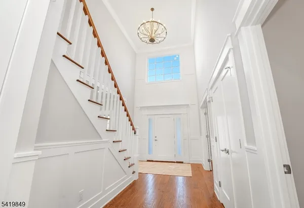 a view of entryway with wooden floor