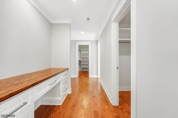 a view of a kitchen from the hallway