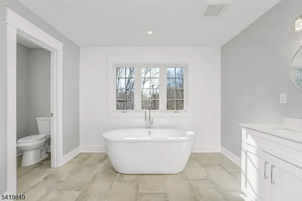 a white room with a toilet